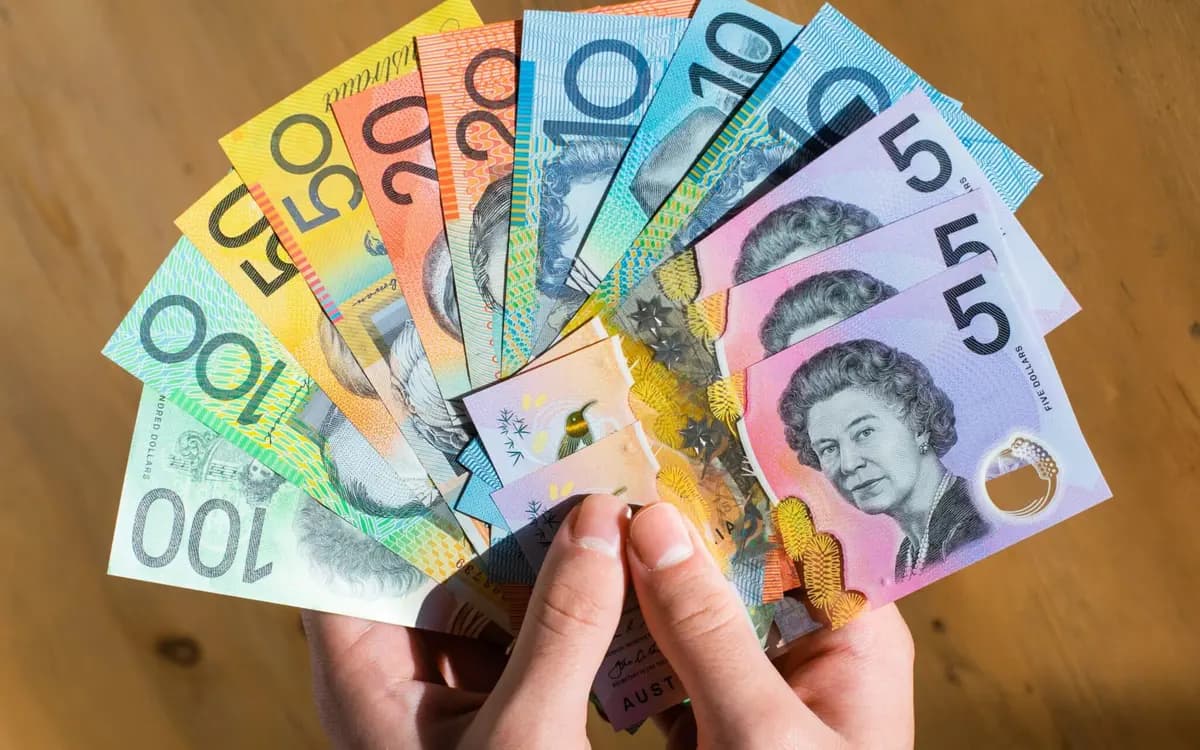 Fake money for party use: clearly marked specimen prop notes fanned on a table