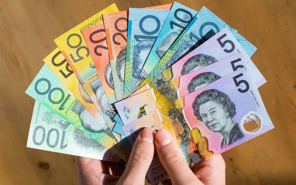 Prop dollar notes fanned in a hand, specimen prop currency for film in Australia