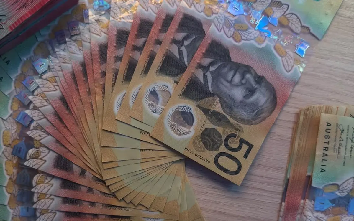 Realistic fake money Australia buyers search for: fanned $50 specimen prop notes shot in natural light